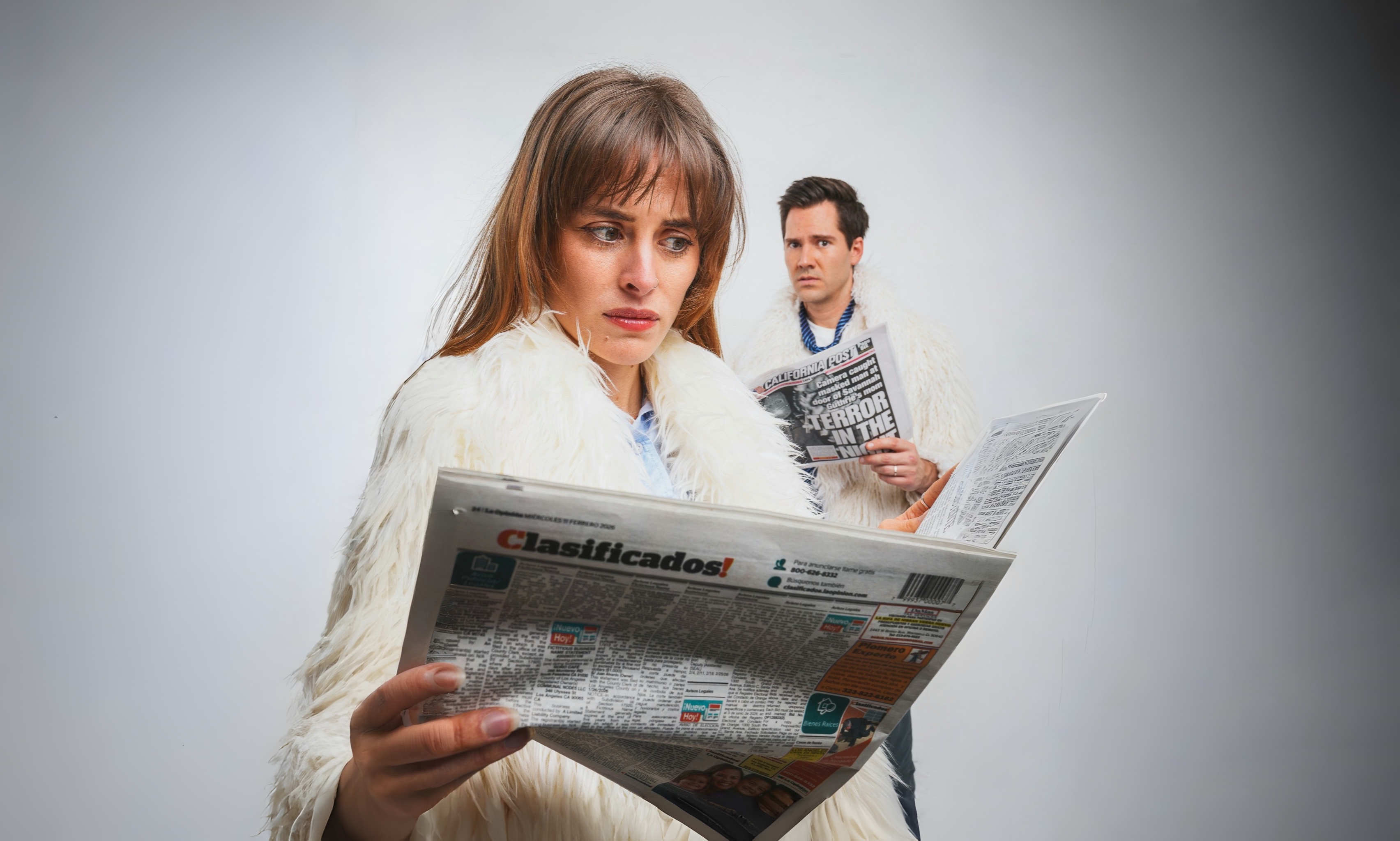 The anchors of Great Job News, reading the news